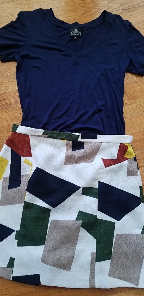 navy v neck top and multi colored mini skirt
